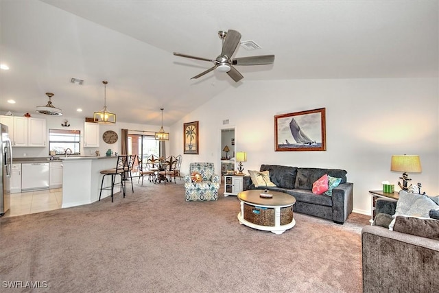 carpeted living room featuring lofted ceiling, sink, and ceiling fan