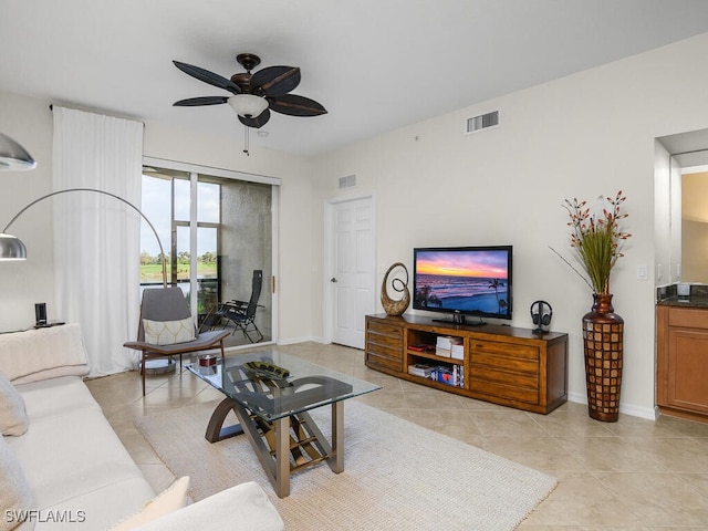 living room featuring light tile patterned flooring and ceiling fan