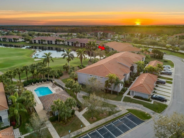 aerial view at dusk with a water view