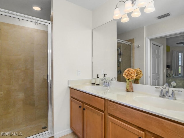 bathroom with vanity and a shower with shower door