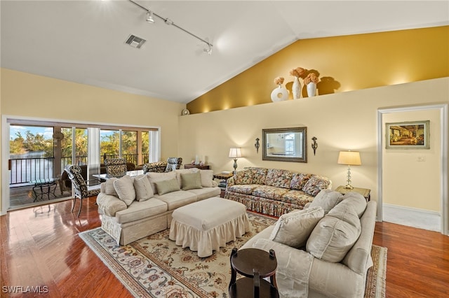 living room with wood-type flooring, high vaulted ceiling, and track lighting