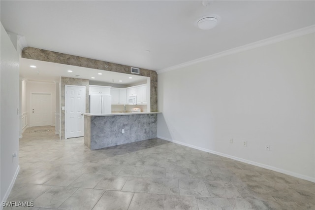 unfurnished living room with crown molding