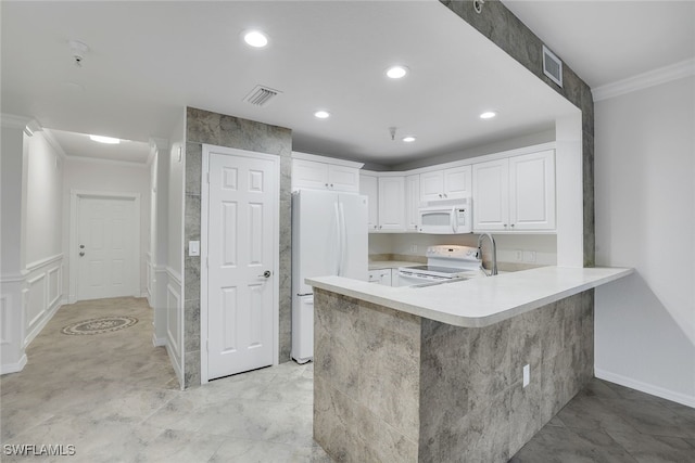 kitchen with white cabinetry, ornamental molding, white appliances, and kitchen peninsula