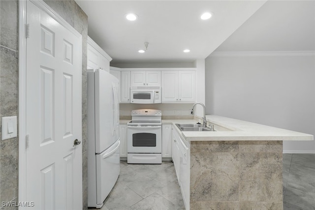 kitchen with sink, white cabinets, kitchen peninsula, crown molding, and white appliances