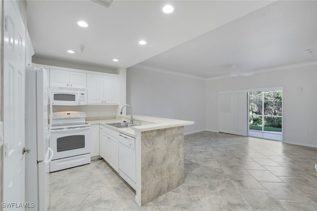 kitchen with sink, white appliances, ornamental molding, white cabinets, and kitchen peninsula