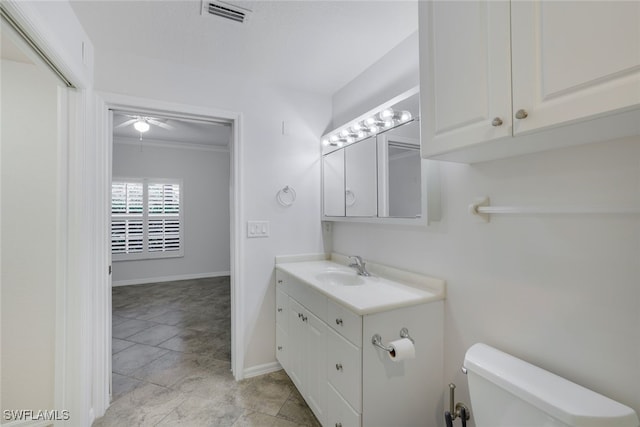 bathroom featuring vanity and toilet