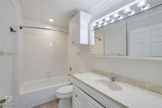 full bathroom with vanity, tiled shower / bath combo, tile patterned floors, and toilet