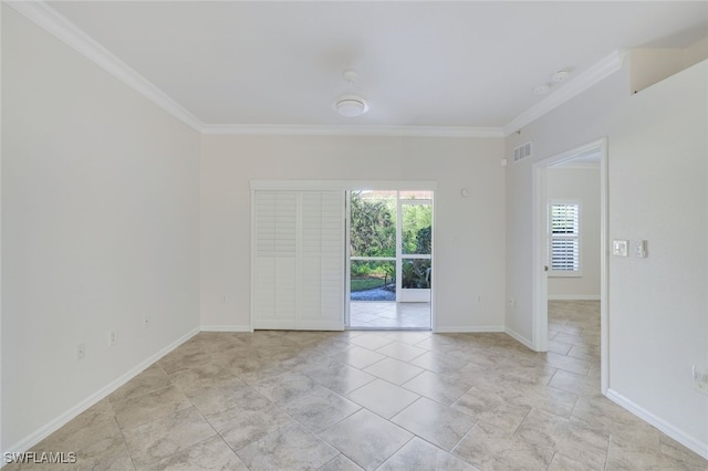 spare room with crown molding