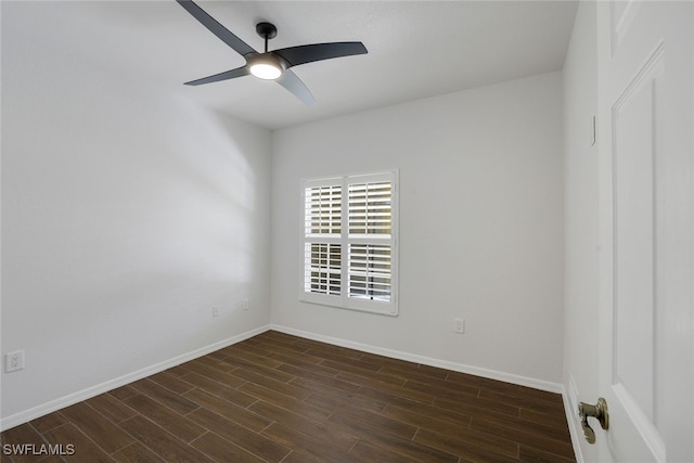 empty room featuring ceiling fan and dark hardwood / wood-style flooring