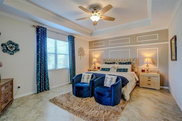 tiled bedroom featuring a tray ceiling, ornamental molding, and ceiling fan