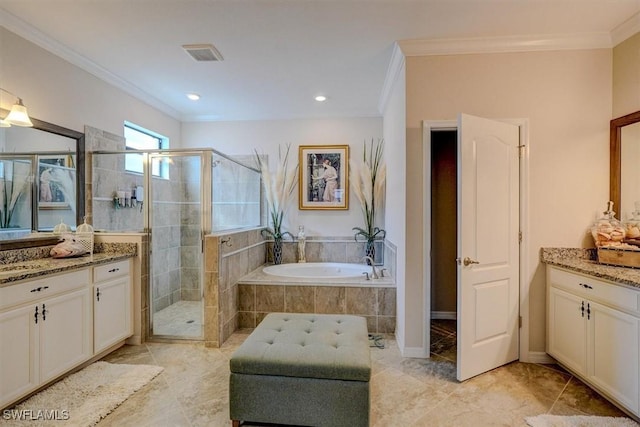 bathroom featuring vanity, ornamental molding, and separate shower and tub