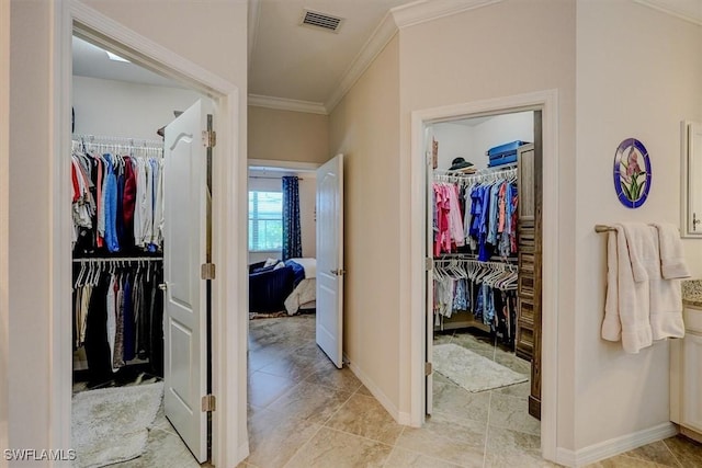 bathroom with crown molding and tile patterned floors