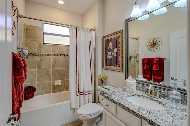 full bathroom with shower / tub combo with curtain, vanity, and toilet