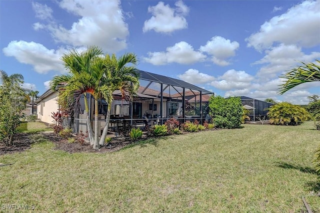 view of yard featuring glass enclosure