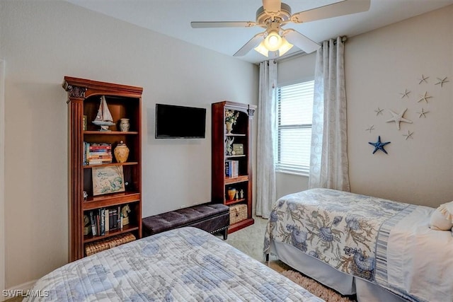 bedroom with ceiling fan and carpet floors