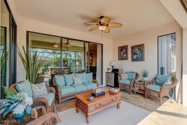 interior space featuring an outdoor living space and ceiling fan