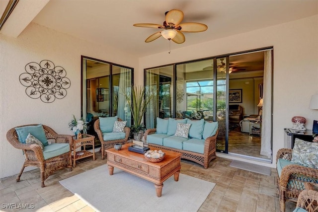 sunroom / solarium with ceiling fan