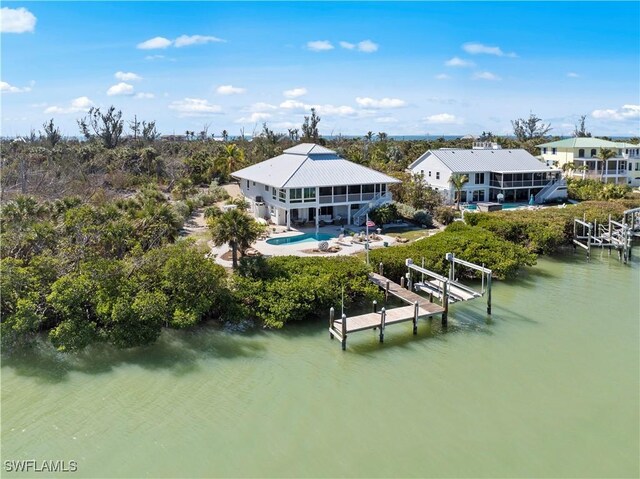 back of house featuring a water view