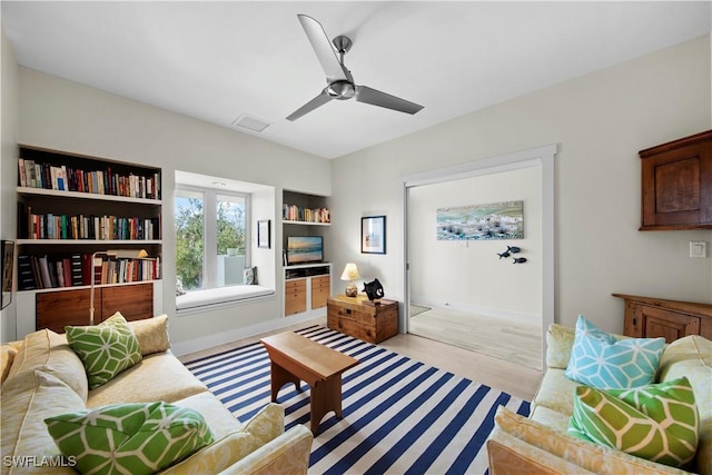 sitting room featuring ceiling fan and light hardwood / wood-style floors