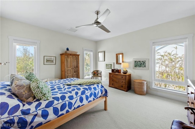 carpeted bedroom featuring access to outside and ceiling fan