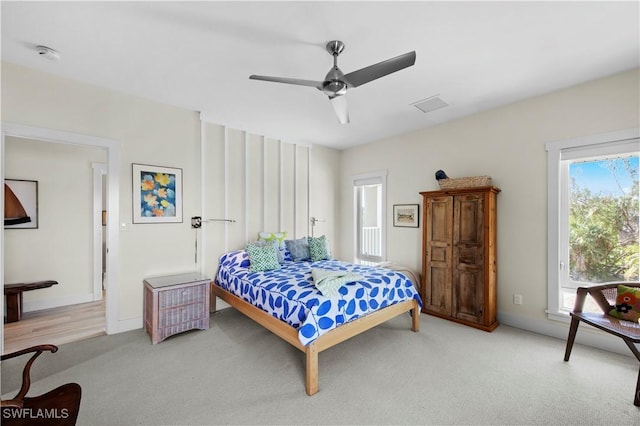 carpeted bedroom with ceiling fan