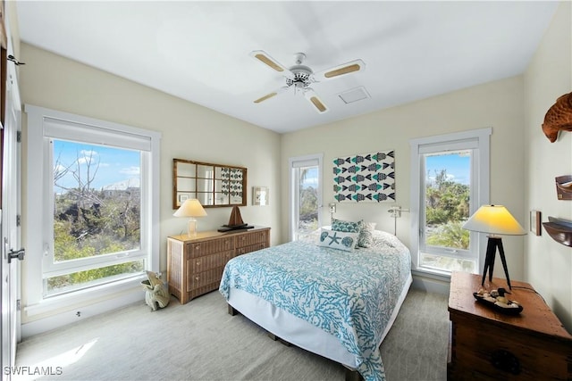 bedroom with ceiling fan and carpet