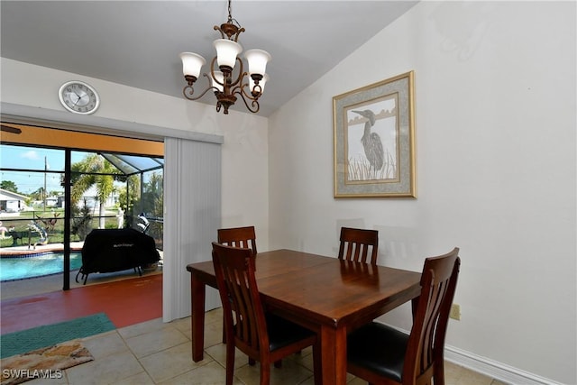 dining space with a notable chandelier and vaulted ceiling