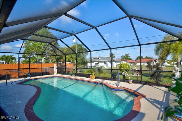 view of swimming pool with a lanai and a patio