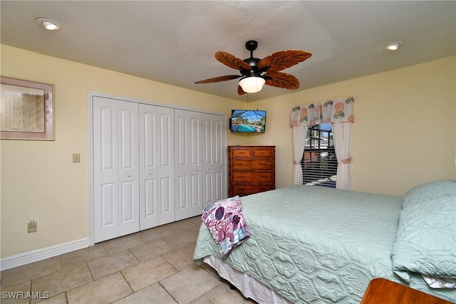 tiled bedroom featuring a closet and ceiling fan