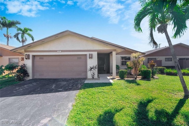 ranch-style home featuring a garage and a front lawn