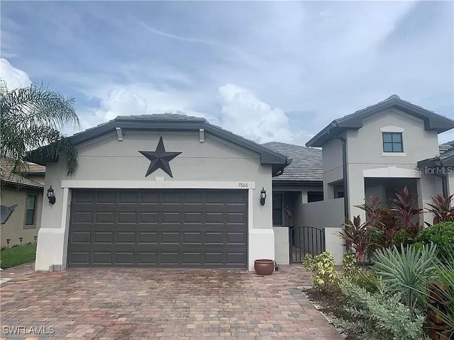 view of front of property featuring a garage