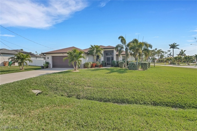 view of front of house with a garage and a front lawn