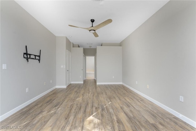 unfurnished room featuring ceiling fan and light hardwood / wood-style flooring