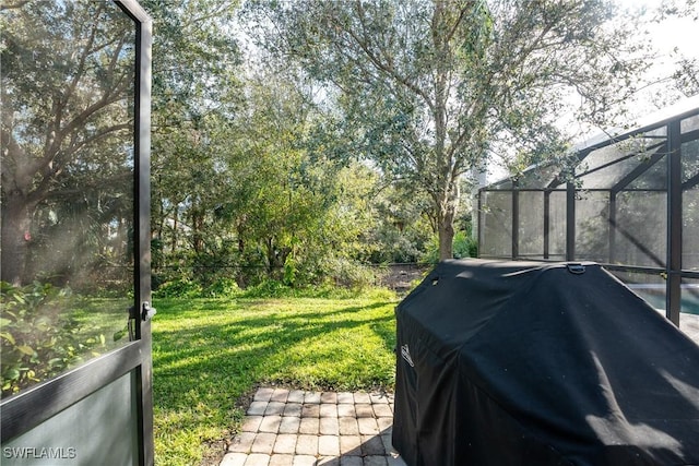 view of yard with a lanai