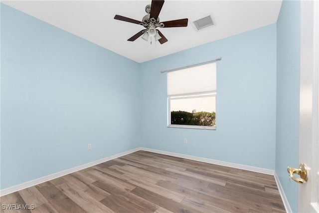 empty room featuring ceiling fan and light hardwood / wood-style flooring