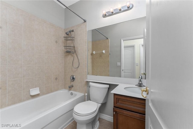 full bathroom with vanity, tiled shower / bath combo, tile patterned floors, and toilet