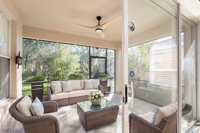 sunroom featuring a ceiling fan