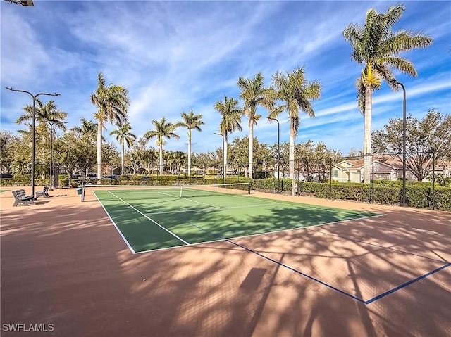 view of tennis court with fence