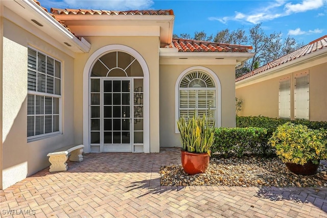 doorway to property featuring a patio area