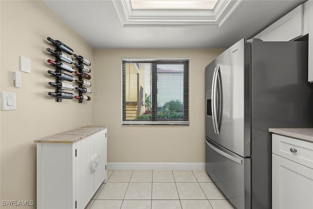 clothes washing area featuring light tile patterned flooring