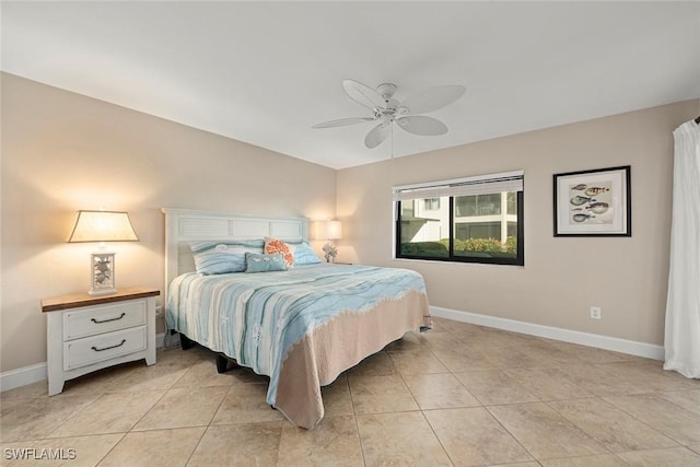 tiled bedroom featuring ceiling fan