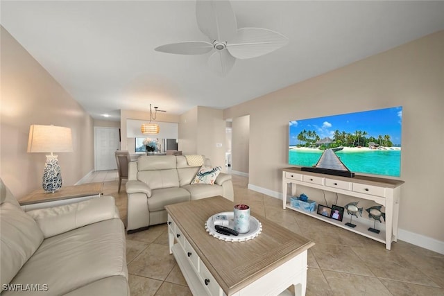 living room featuring light tile patterned floors and ceiling fan