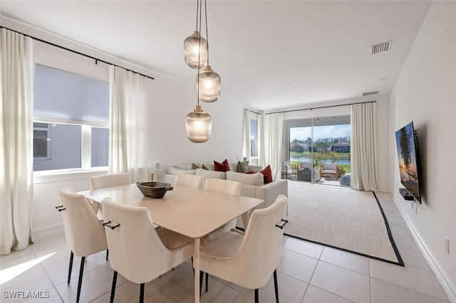 dining space featuring light tile patterned floors