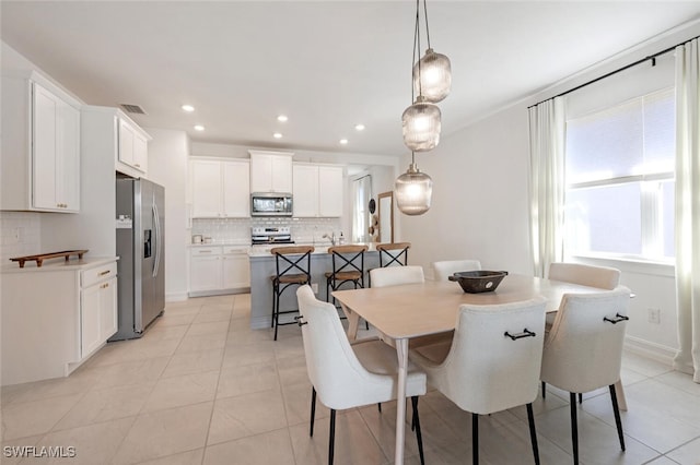 dining room with light tile patterned flooring