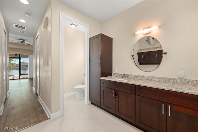 908 SW Embers Ter, Cape Coral, FL 33991 - bathroom with vanity, a ceiling fan, and recessed lighting