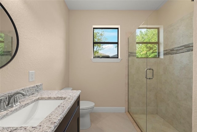 908 SW Embers Ter, Cape Coral, FL 33991 - bathroom featuring a shower stall, vanity, and tile patterned floors