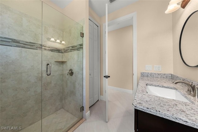 908 SW Embers Ter, Cape Coral, FL 33991 - bathroom with vanity, a shower stall, and tile patterned floors