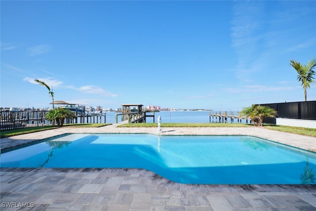 view of swimming pool with a water view