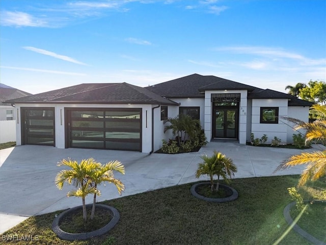 view of front of property featuring a garage and a front yard