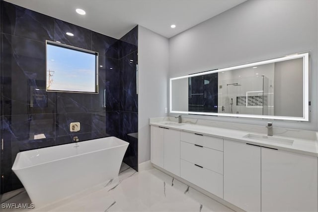 bathroom with plus walk in shower and vanity